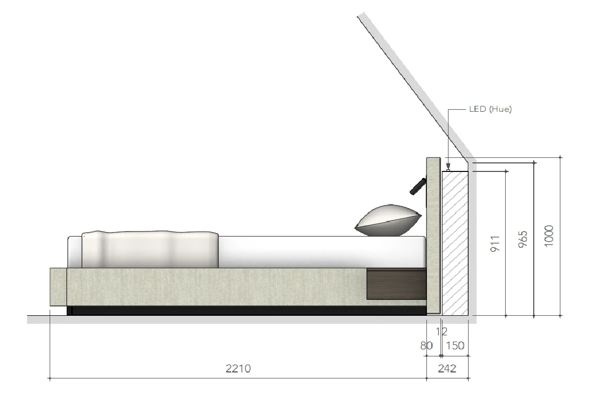 Bed iets naar voren geplaatst onder een schuin dak